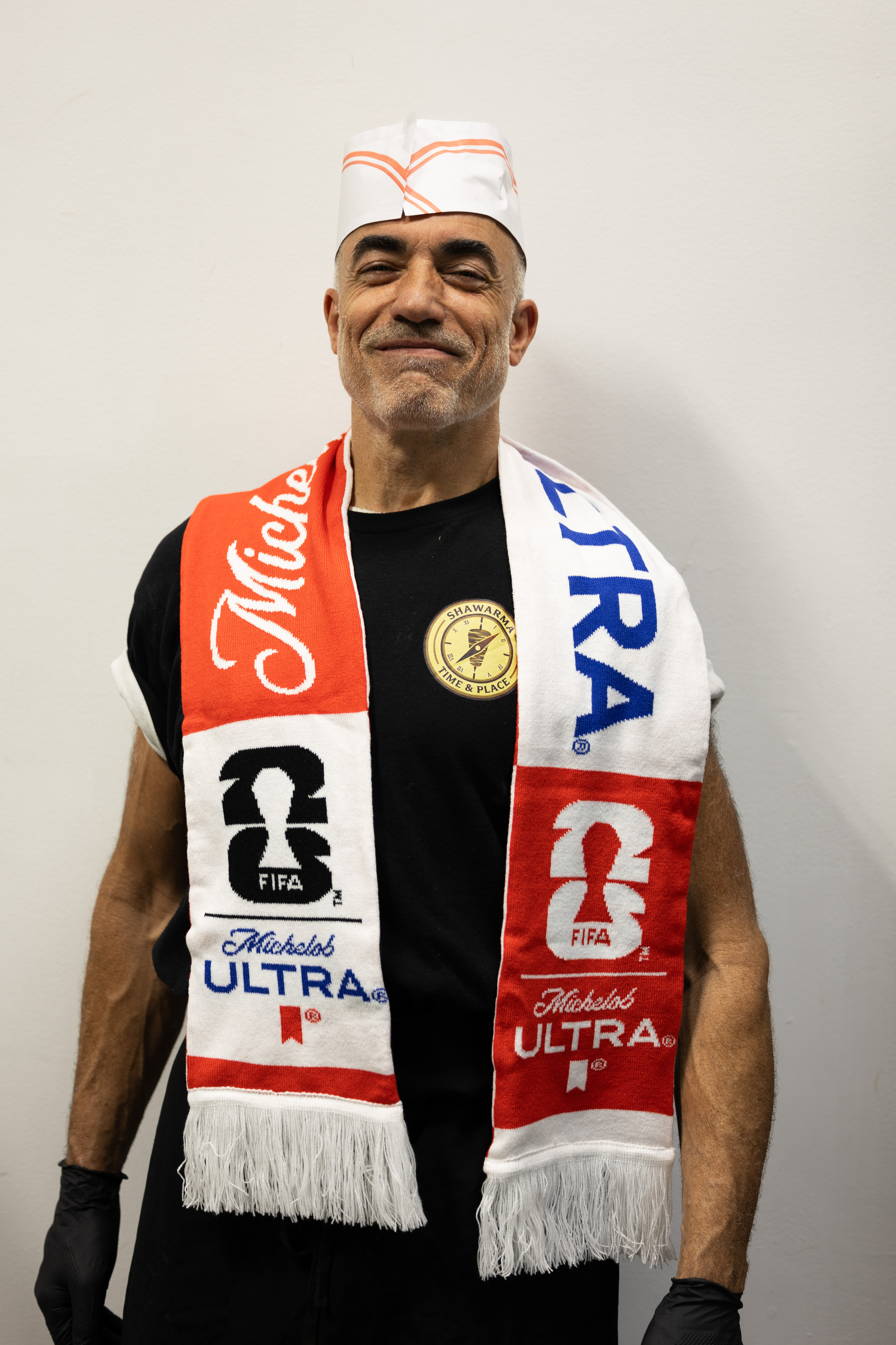 Chef Abou Adal smiling, wearing the Shawarma Time & Place badge