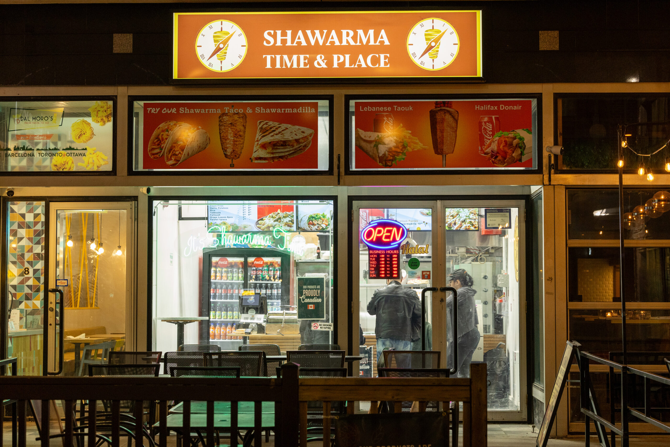 Shawarma Time & Place storefront at night.